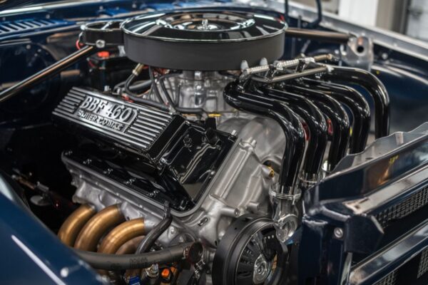 A detailed image of BBF 460 Super Cobra Jet headers installed in a high-performance engine.